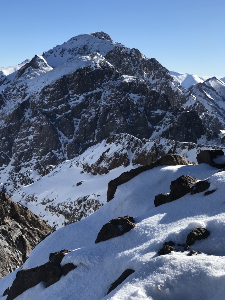 Snow-covered mountain peaks with dramatic rocky terrain